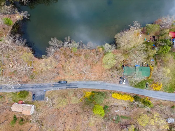 a swimming pool with trees in the background