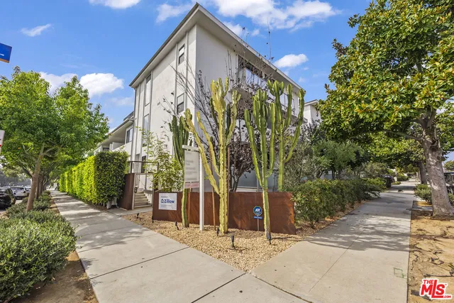 a view of a house with a tree