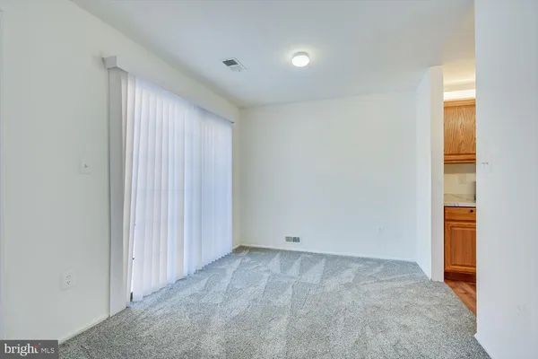 a bathroom with a shower a sink a toilet and vanity