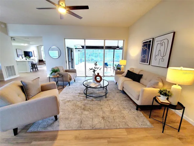 a living room with furniture and a large window