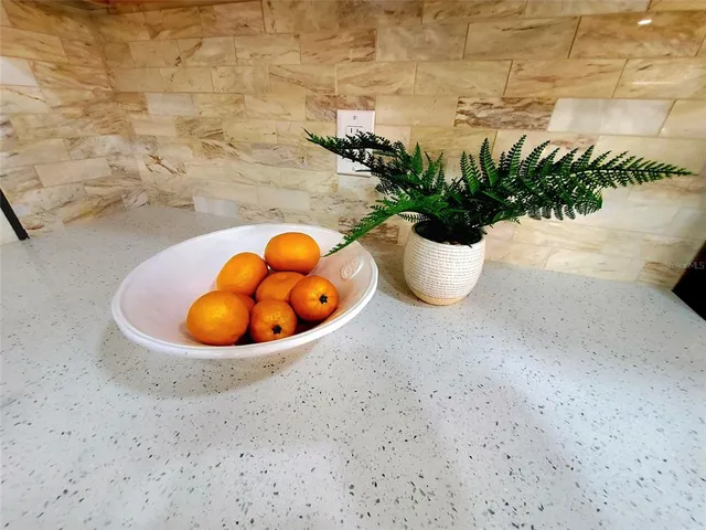 a view of a vase of flowers sitting on a table