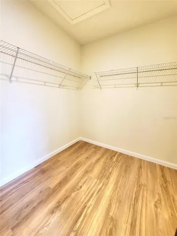 a bathroom with a tub sink a mirror and a shower