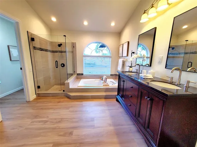 a spacious bathroom with a sink and a mirror