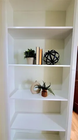 a kitchen with granite countertop sink and cabinets