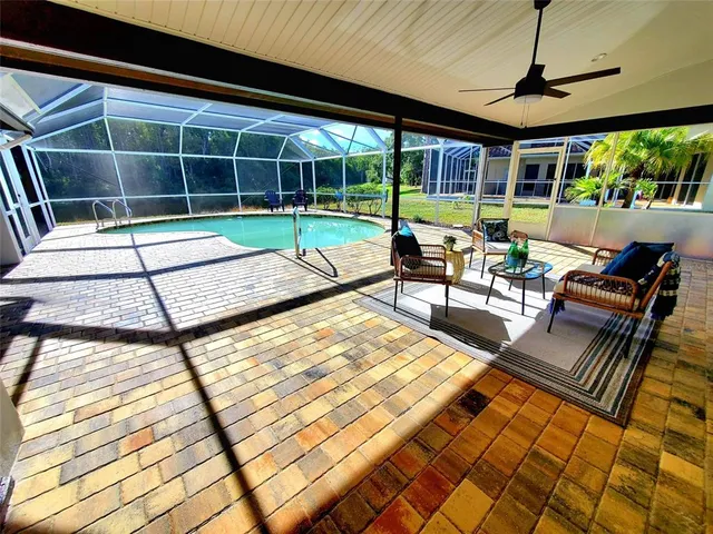 a view of a swimming pool with a patio