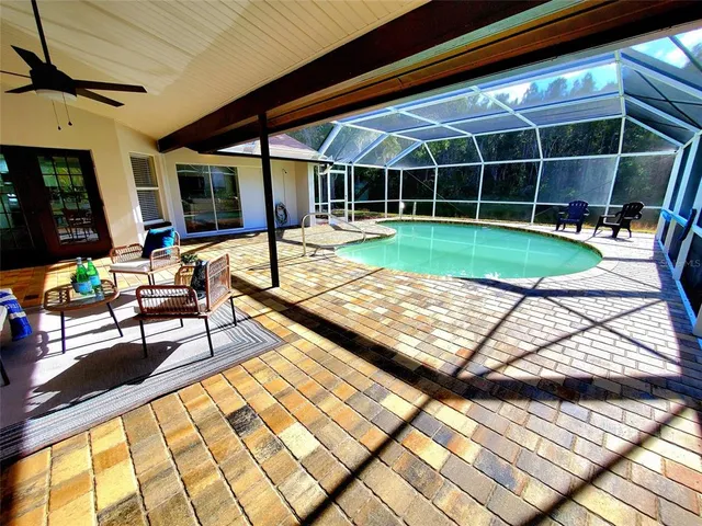 a view of swimming pool with seating area