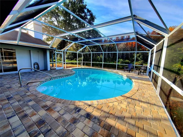 a view of a lake with a house in the background