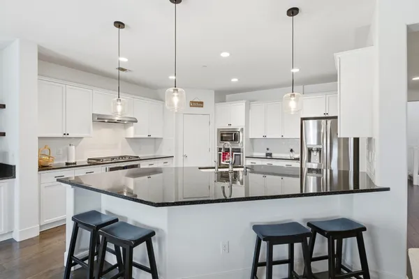a kitchen with a stove and cabinets