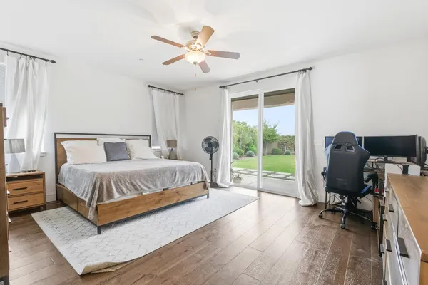 a bathroom with a sink a large mirror and a bathtub