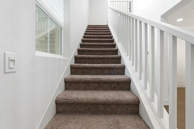 a kitchen with white cabinets