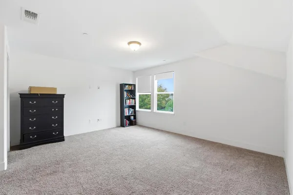 a view of a porch with furniture and a yard