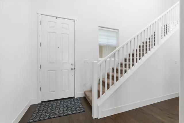 a view of entryway with wooden floor
