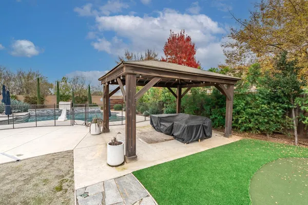 a view of a swimming pool with a patio