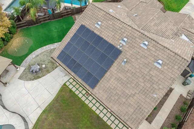 an aerial view of a house with outdoor space