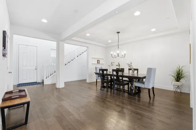 a view of a dining room with furniture window and wooden floor