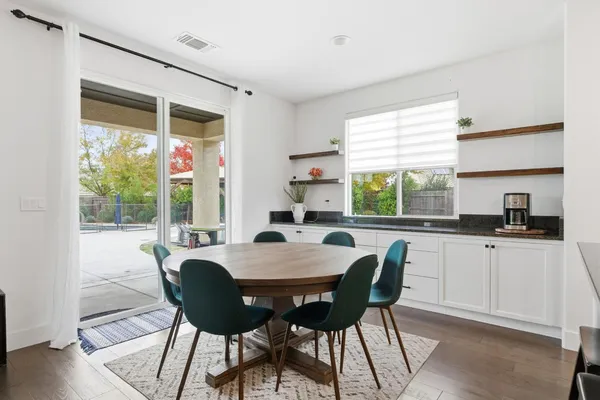 a view of a dining room with furniture window and outside view