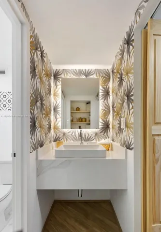 a bathroom with a sink and a mirror