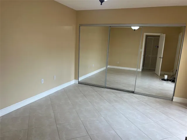 an empty room with a bathroom
