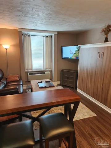 a bedroom with furniture and window
