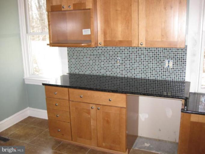 4210 Clarkdale Road Baltimore, MD 21209 - Photo 6 of 9 a view of granite countertop cabinets