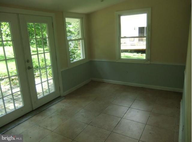 4210 Clarkdale Road Baltimore, MD 21209 - Photo 7 of 9 a view of an empty room with a window