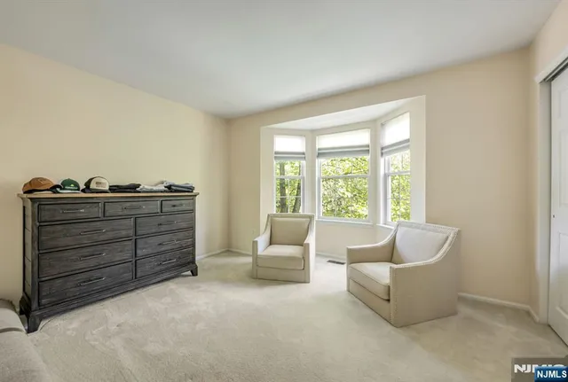 a living room with furniture and windows