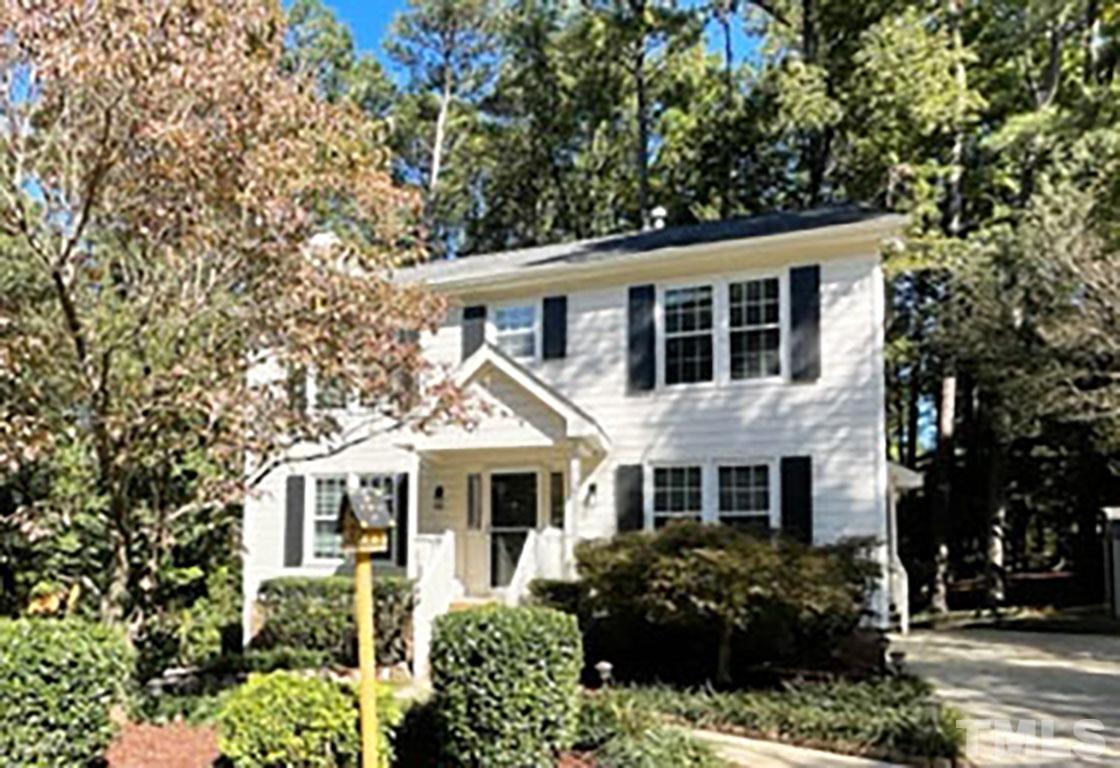 7544 Milestone Court Raleigh, NC 27615 - Photo 1 of 30 a front view of a house with a garden