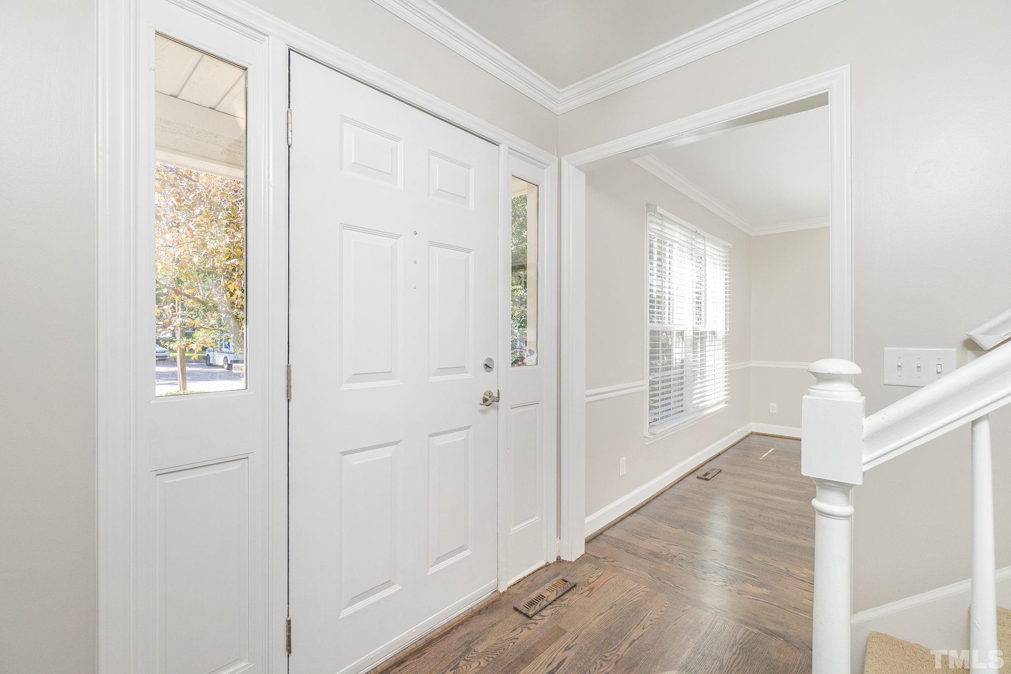 7544 Milestone Court Raleigh, NC 27615 - Photo 2 of 30 a view of entryway with window and wooden floor