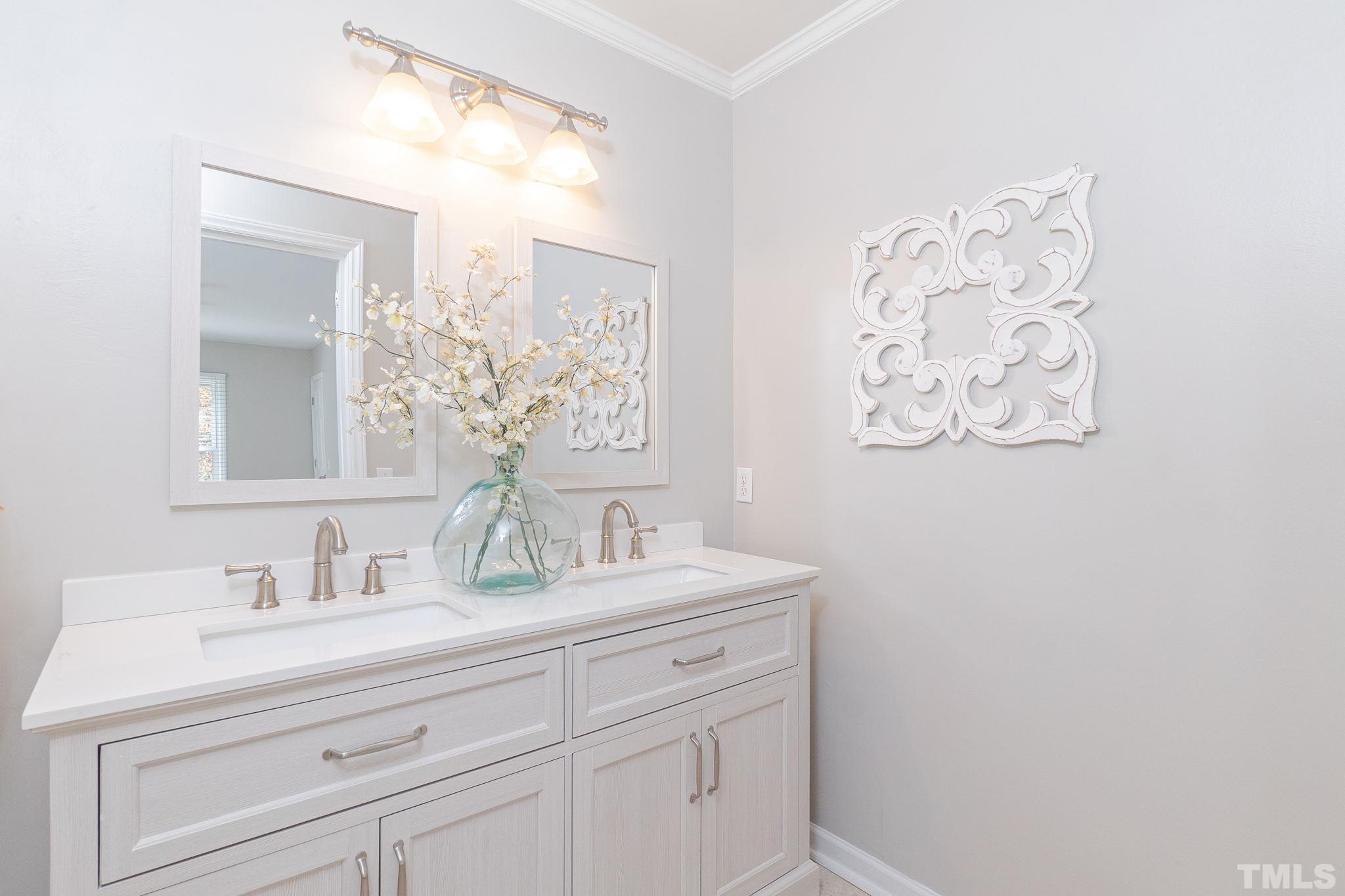 7544 Milestone Court Raleigh, NC 27615 - Photo 20 of 30 a bathroom with a sink and a mirror