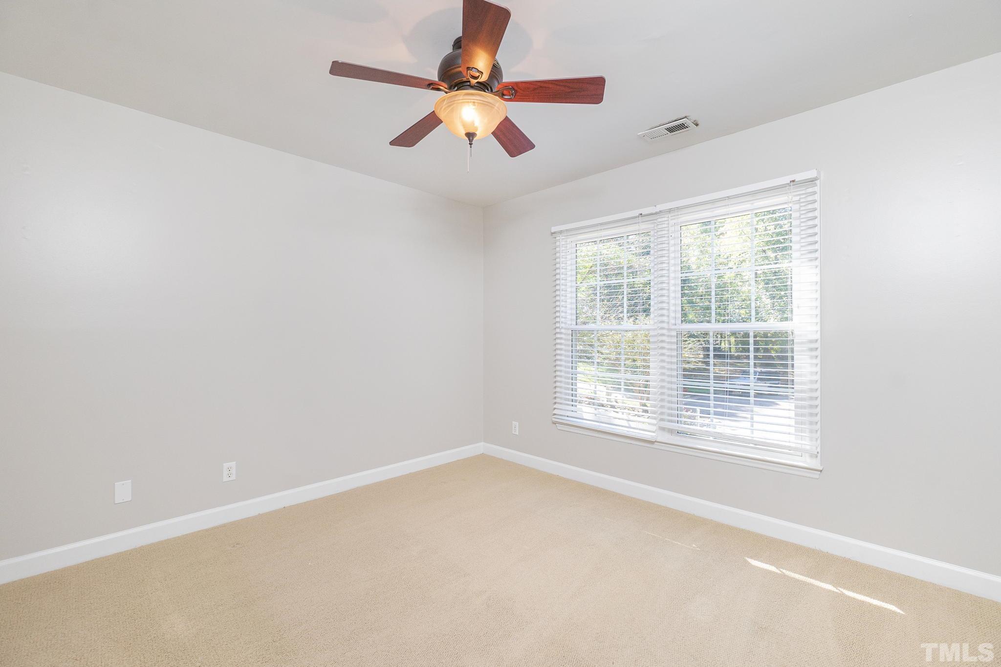 7544 Milestone Court Raleigh, NC 27615 - Photo 22 of 30 a view of an empty room with a window