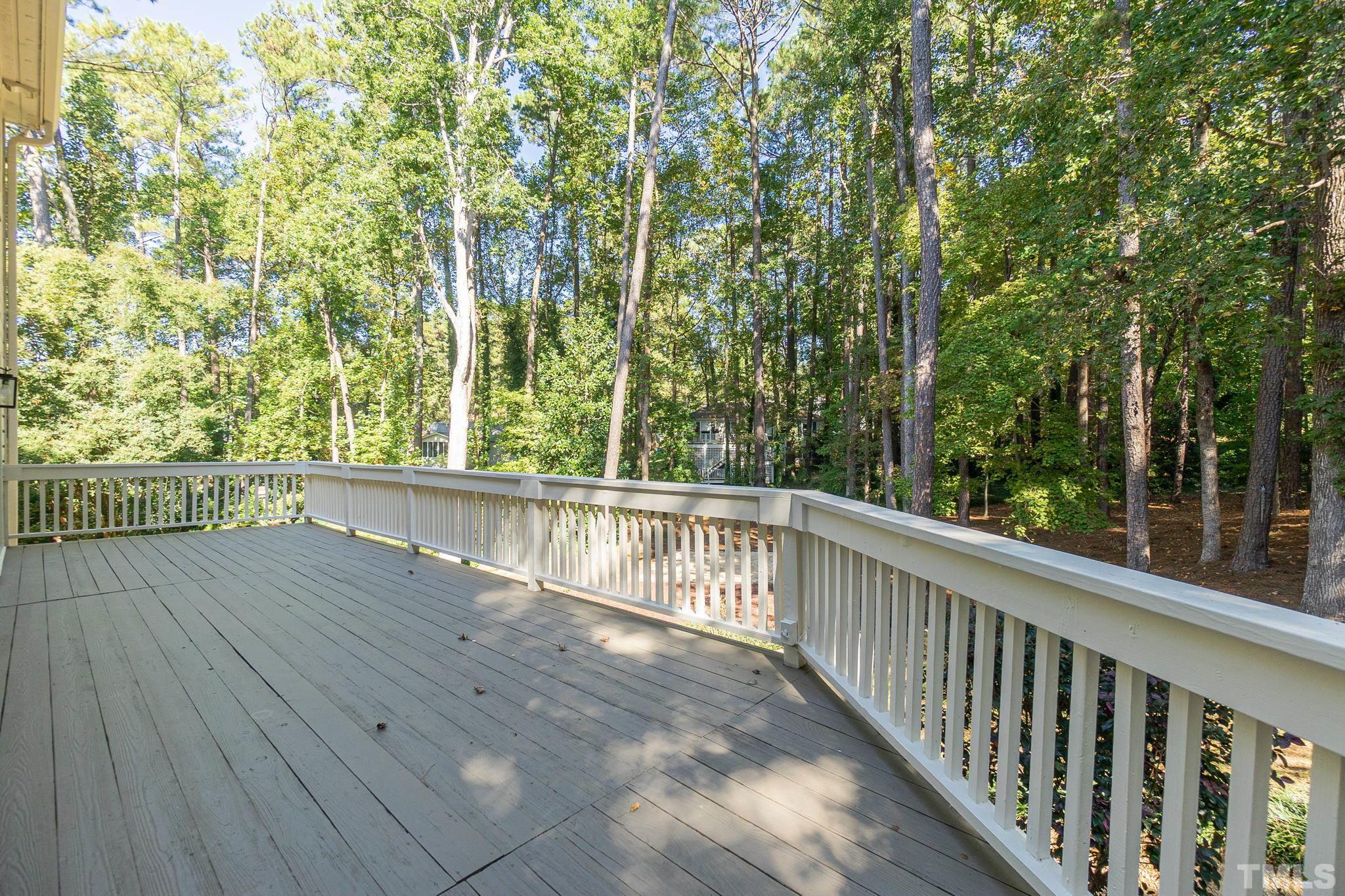 7544 Milestone Court Raleigh, NC 27615 - Photo 27 of 30 a view of balcony with wooden floor
