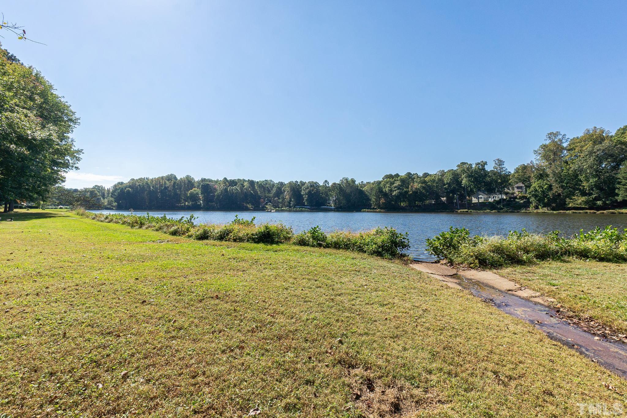 7544 Milestone Court Raleigh, NC 27615 - Photo 30 of 30 a view of a lake with houses in background