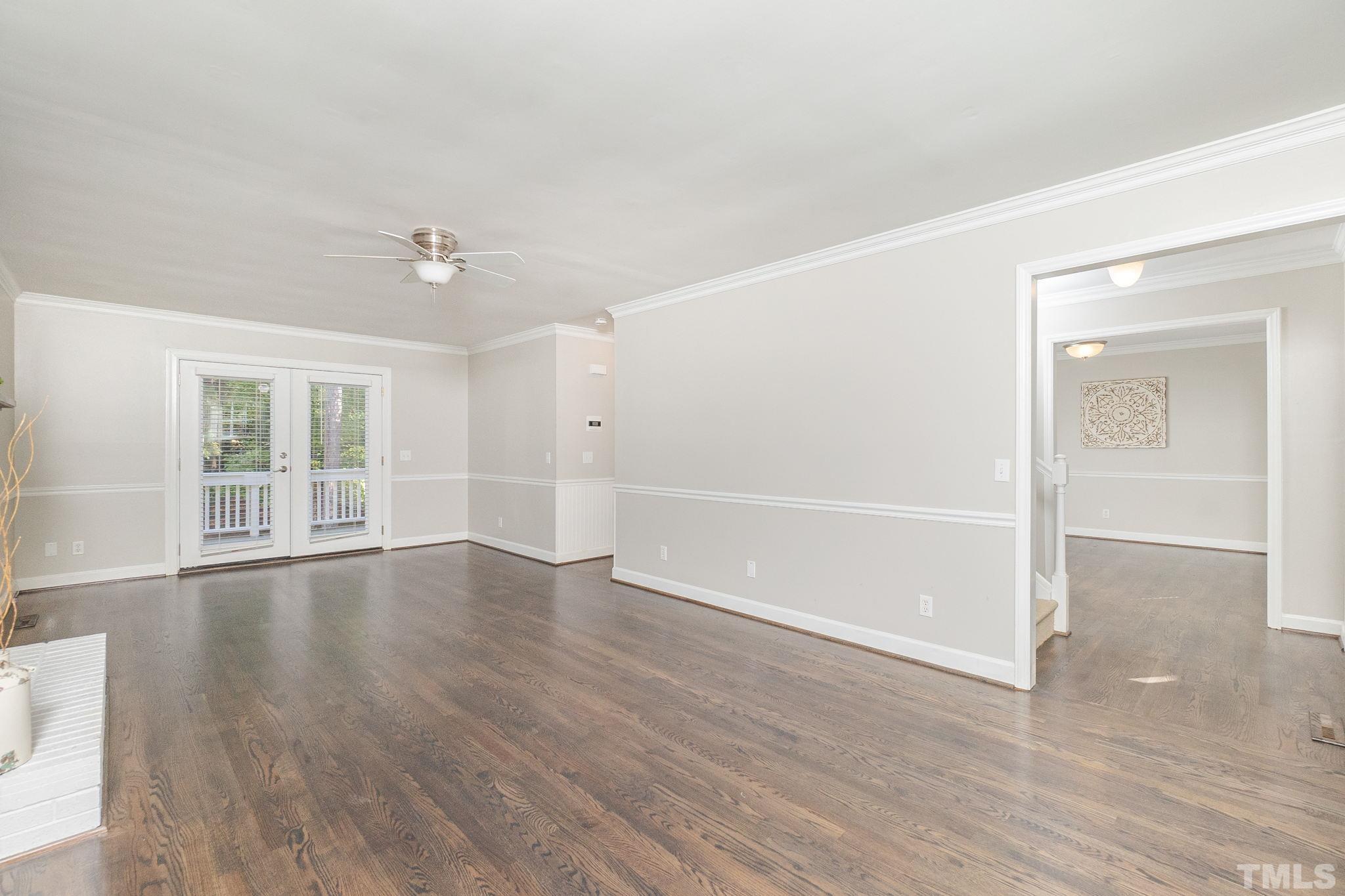 7544 Milestone Court Raleigh, NC 27615 - Photo 6 of 30 wooden floor in an empty room with a window