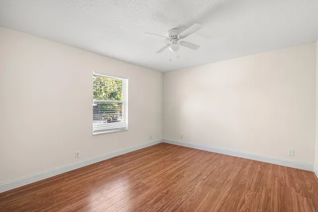a view of a chairs and table in the patio