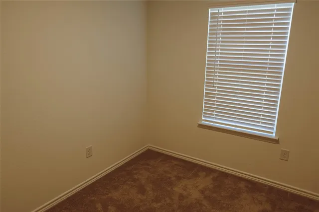 a view of a room that has a window in it