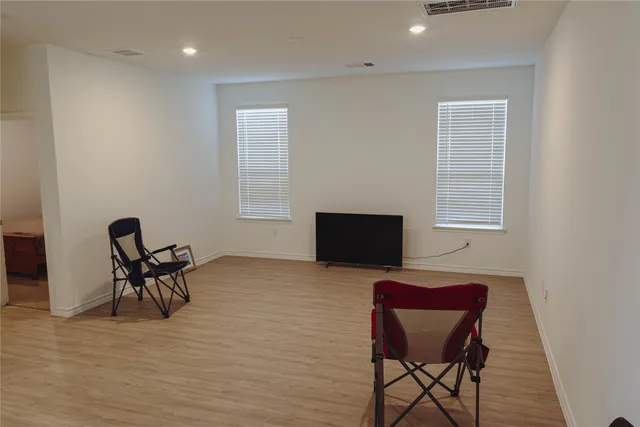 a workspace with furniture and a wooden floor