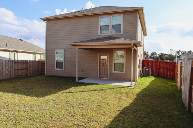 a view of a house with a yard and garage