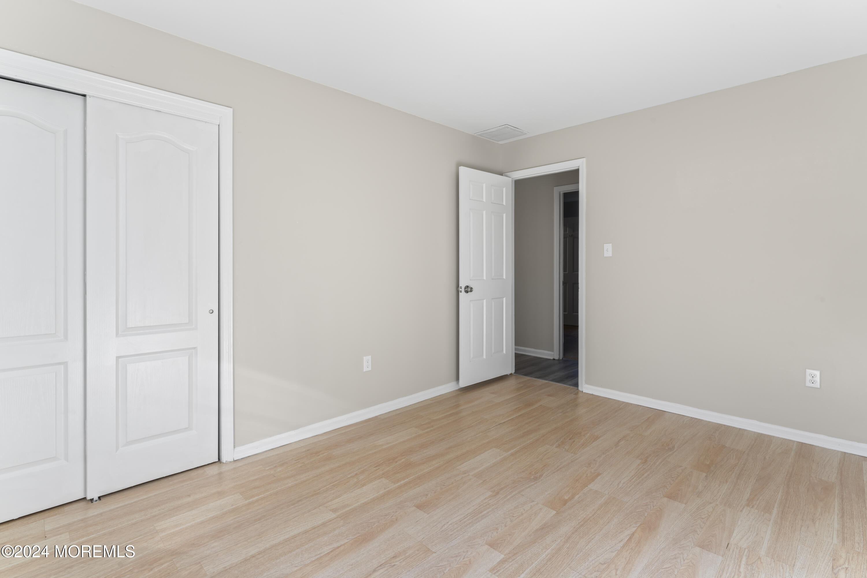 321 Float Avenue Manahawkin, NJ 08050 - Photo 11 of 31 a view of an empty room with wooden floor