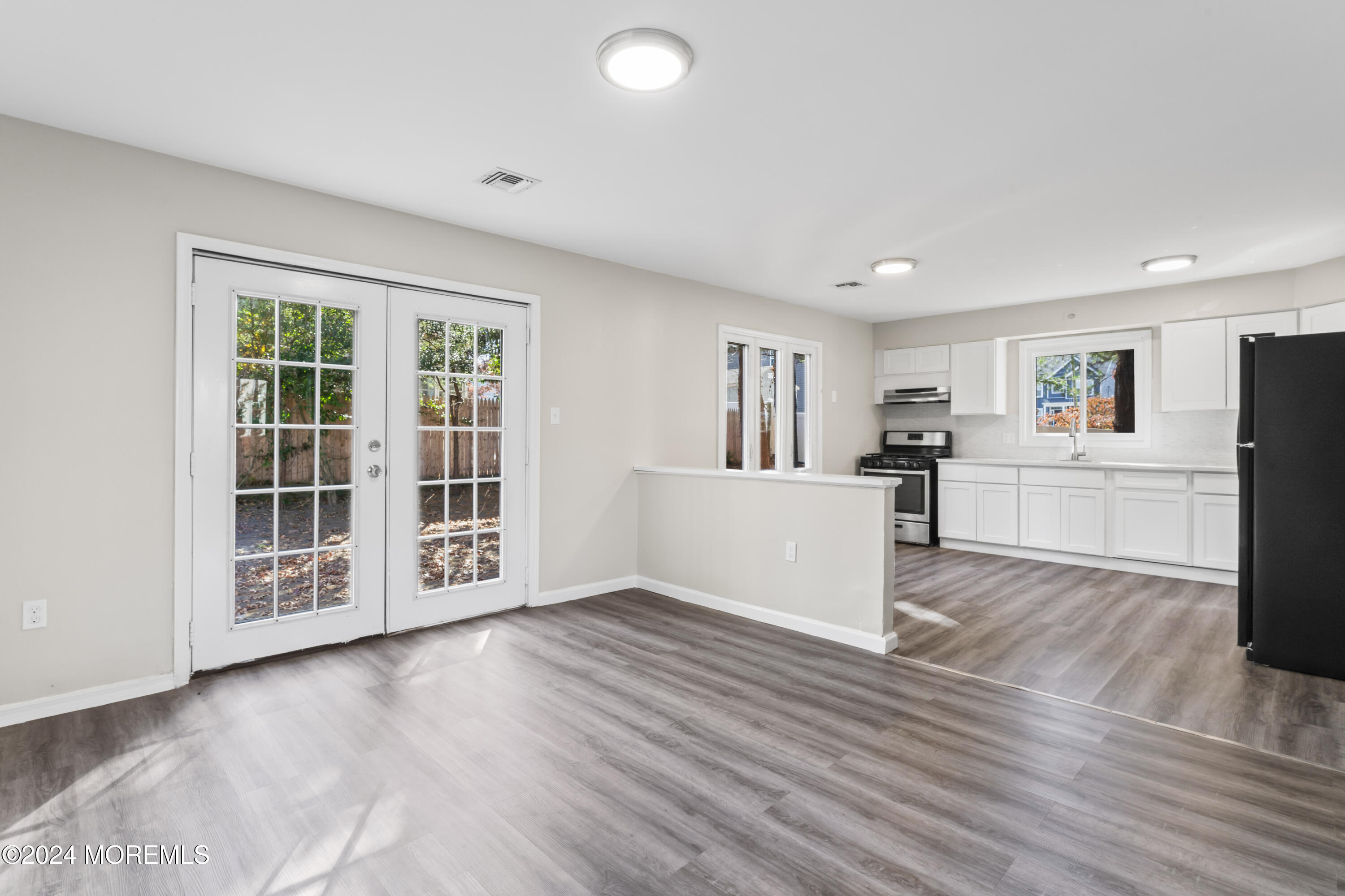 321 Float Avenue Manahawkin, NJ 08050 - Photo 19 of 31 a view of a kitchen with wooden floor and a window