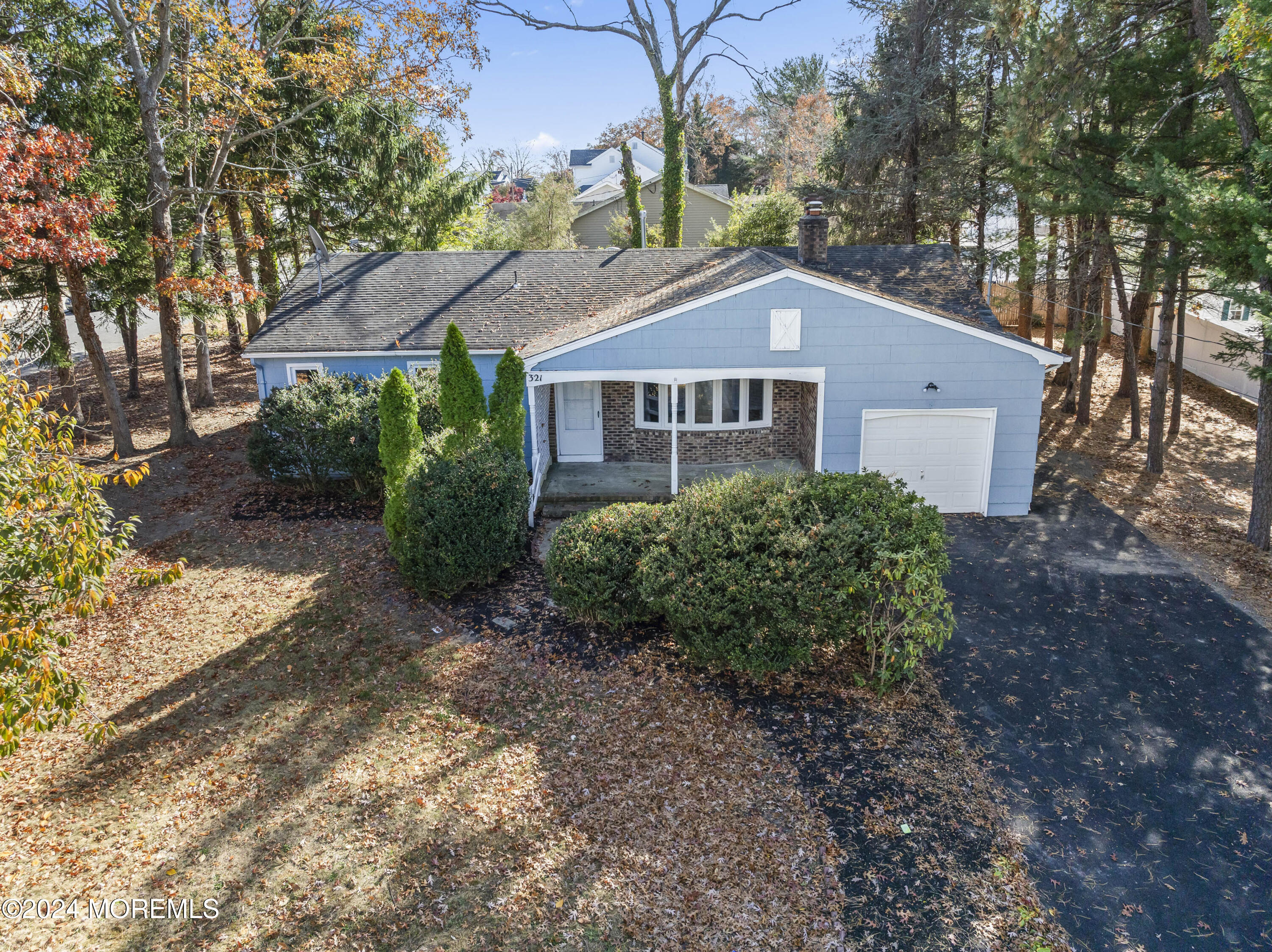 321 Float Avenue Manahawkin, NJ 08050 - Photo 22 of 31 a front view of a house with a yard