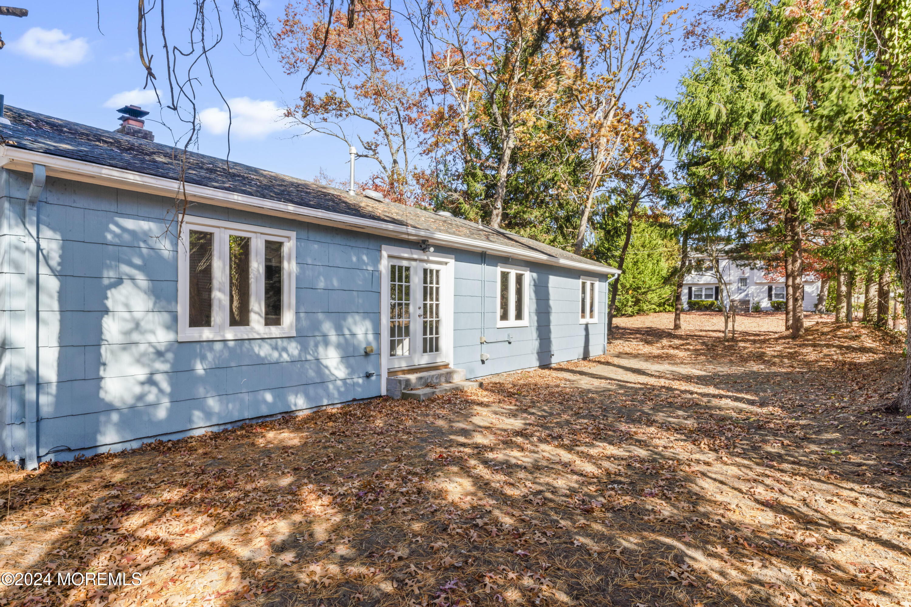 321 Float Avenue Manahawkin, NJ 08050 - Photo 26 of 31 a front view of a house with a yard