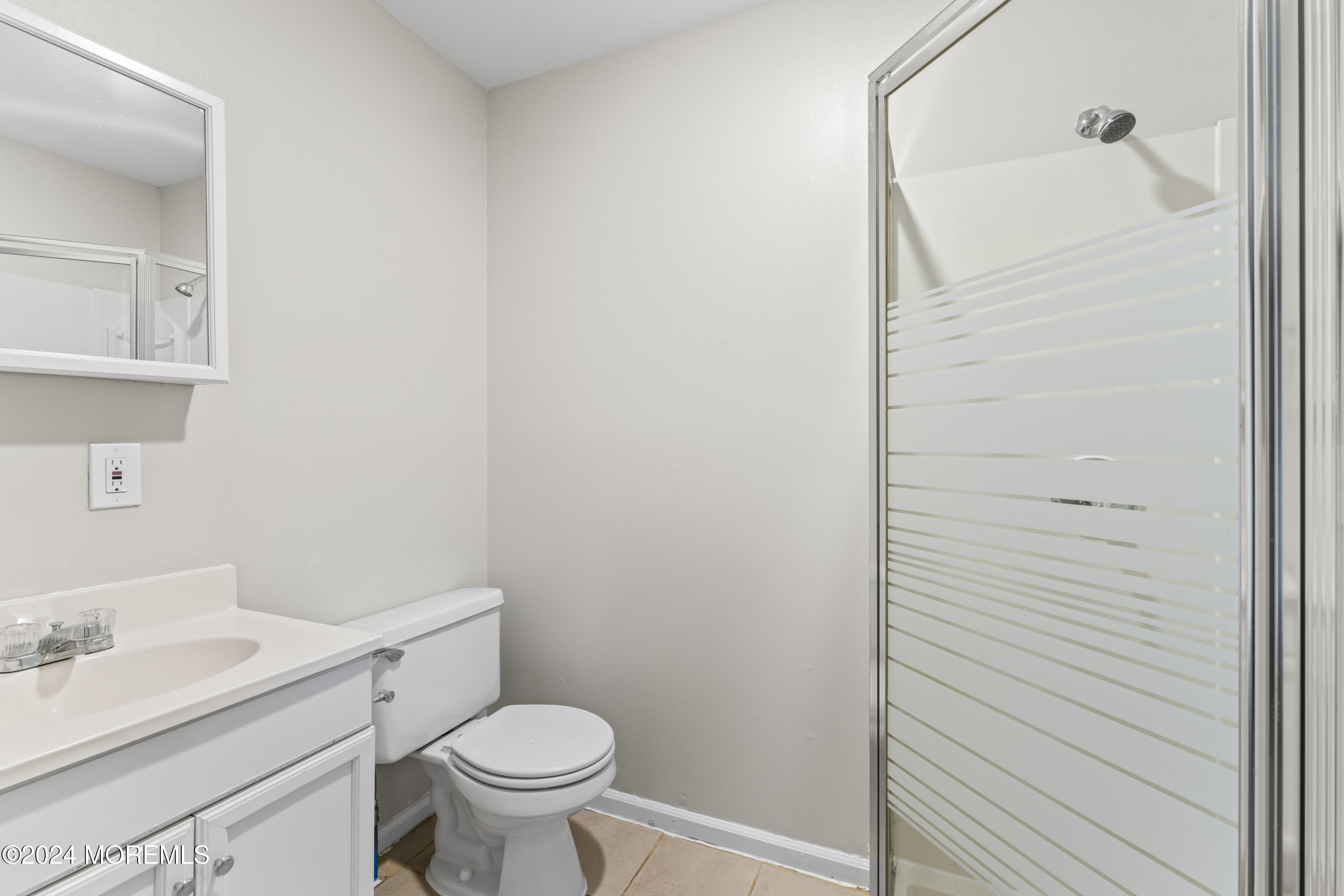 321 Float Avenue Manahawkin, NJ 08050 - Photo 6 of 31 a bathroom with a granite countertop toilet and a sink