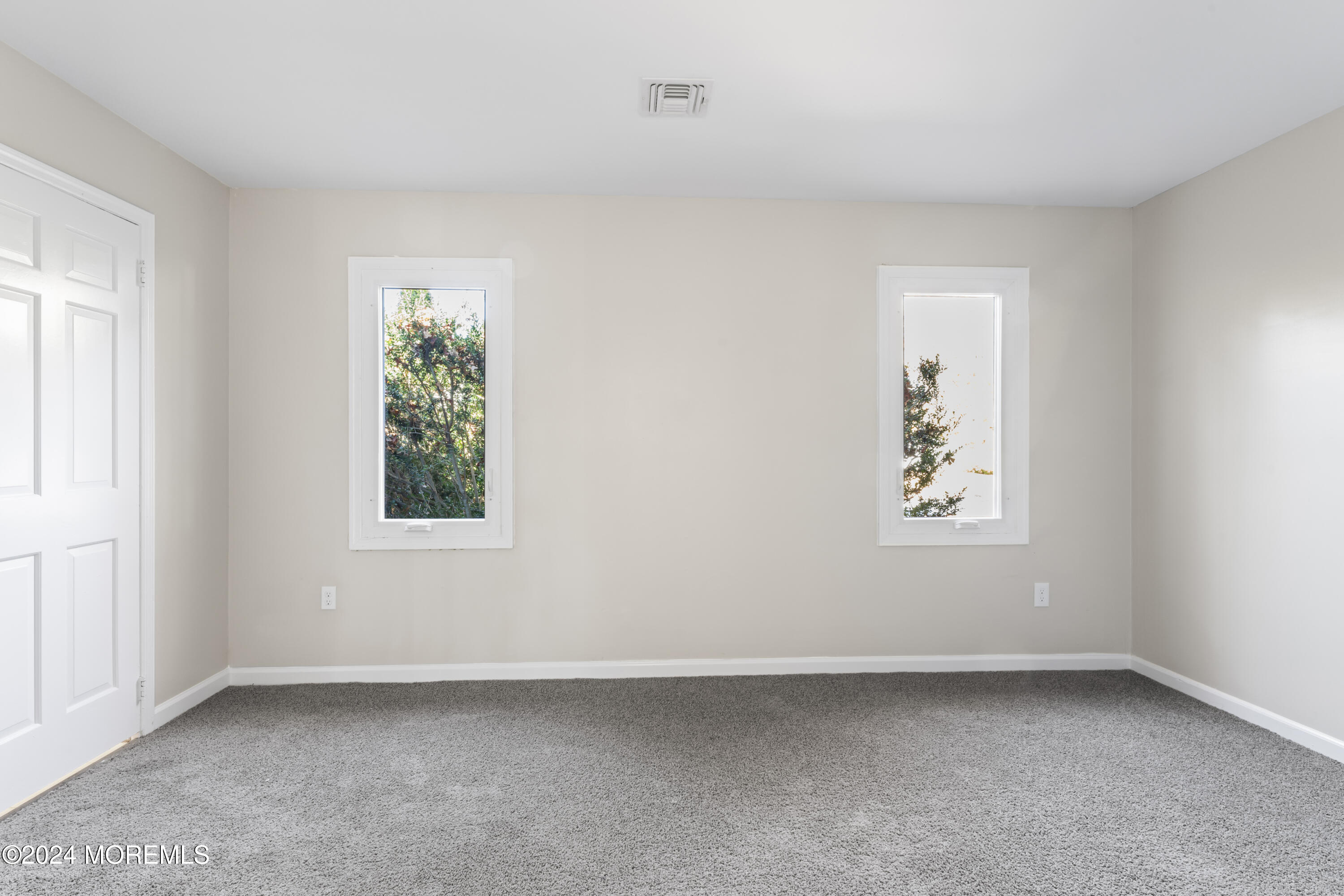 321 Float Avenue Manahawkin, NJ 08050 - Photo 8 of 31 an empty room with a window
