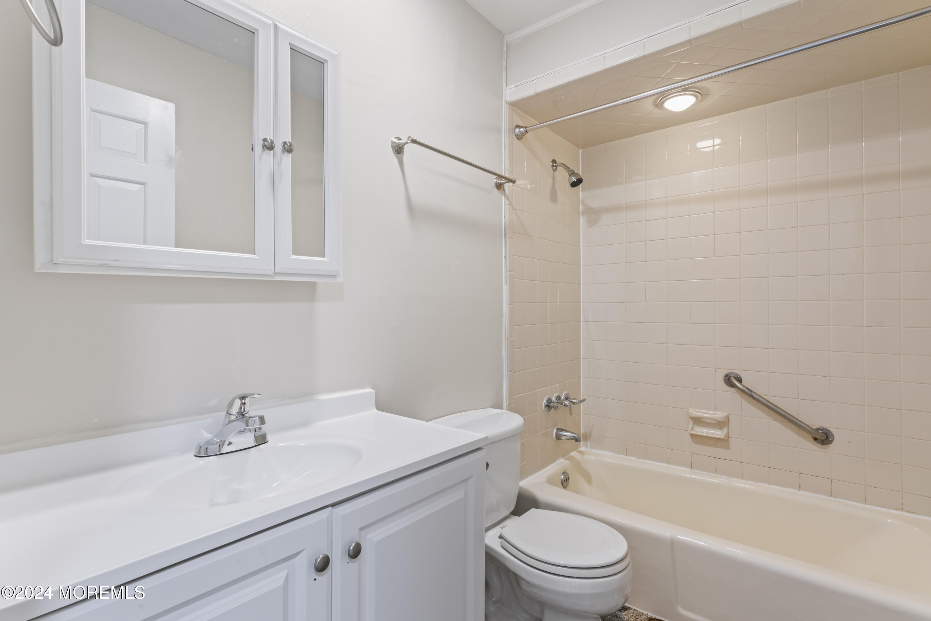 321 Float Avenue Manahawkin, NJ 08050 - Photo 9 of 31 a bathroom with a sink a toilet and a bathtub