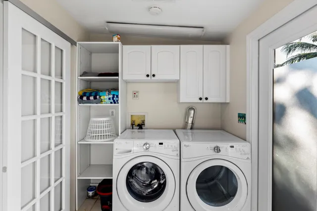 a view of kitchen and utility room with washer and dryer