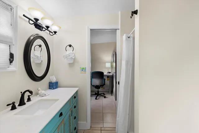 a bathroom with a sink and a mirror