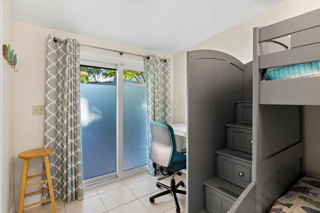 a view of workspace with furniture and a window