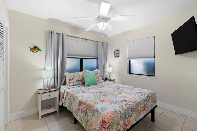 a bedroom with a bed and a television