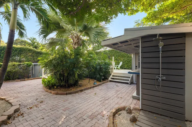 a view of a house with a door and a yard