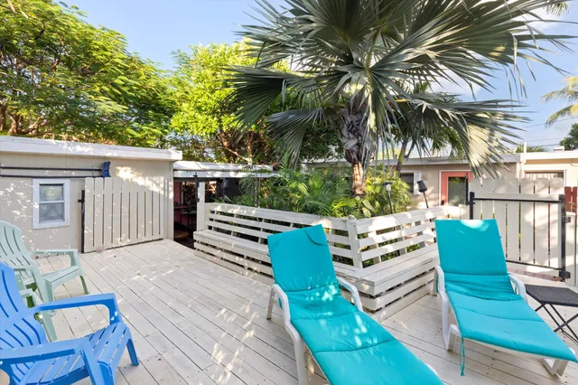 a view of a bench in backyard of the house